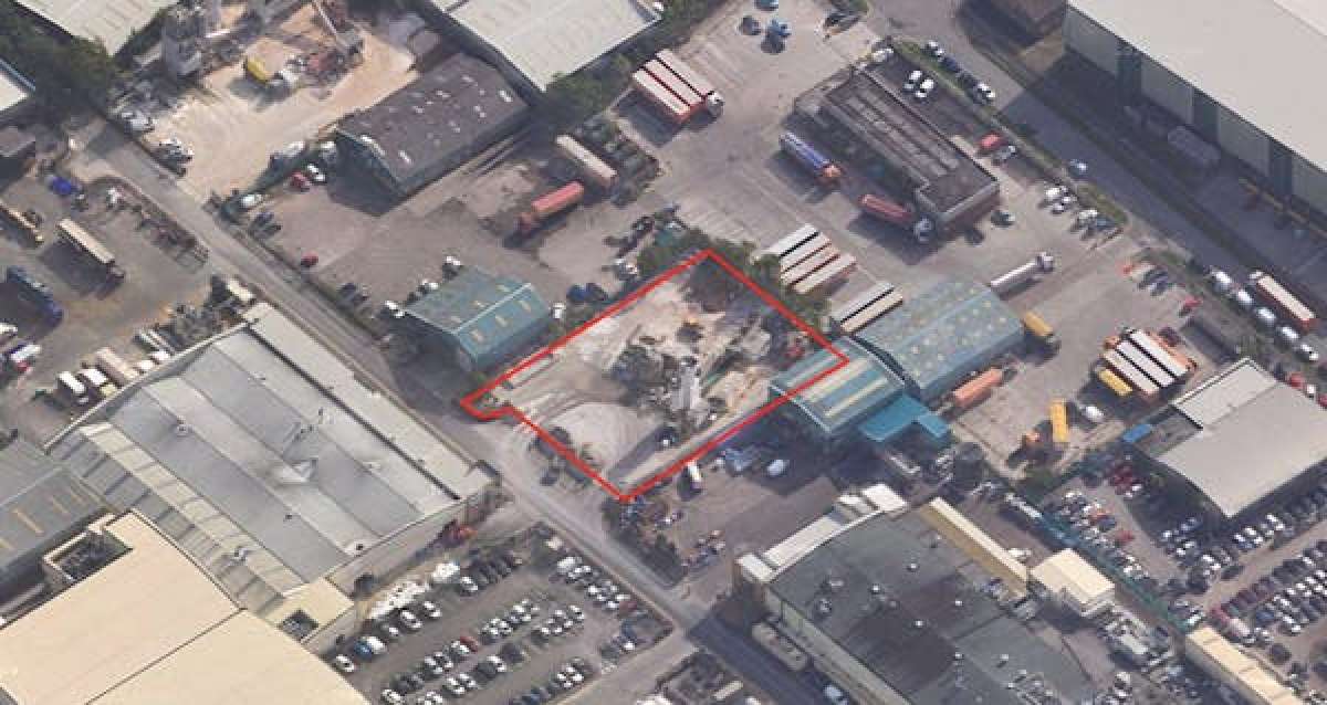 A securely fenced, rectangular concrete surfaced plot on a 0.53 acre site in Crewe